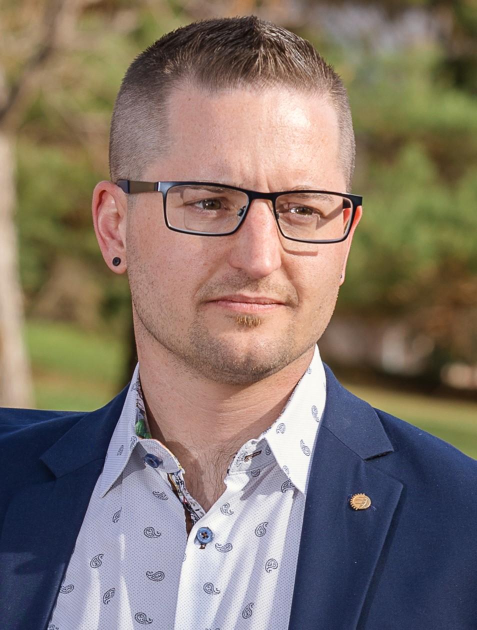 Professional headshot of Amerigo (Mico) Tinor